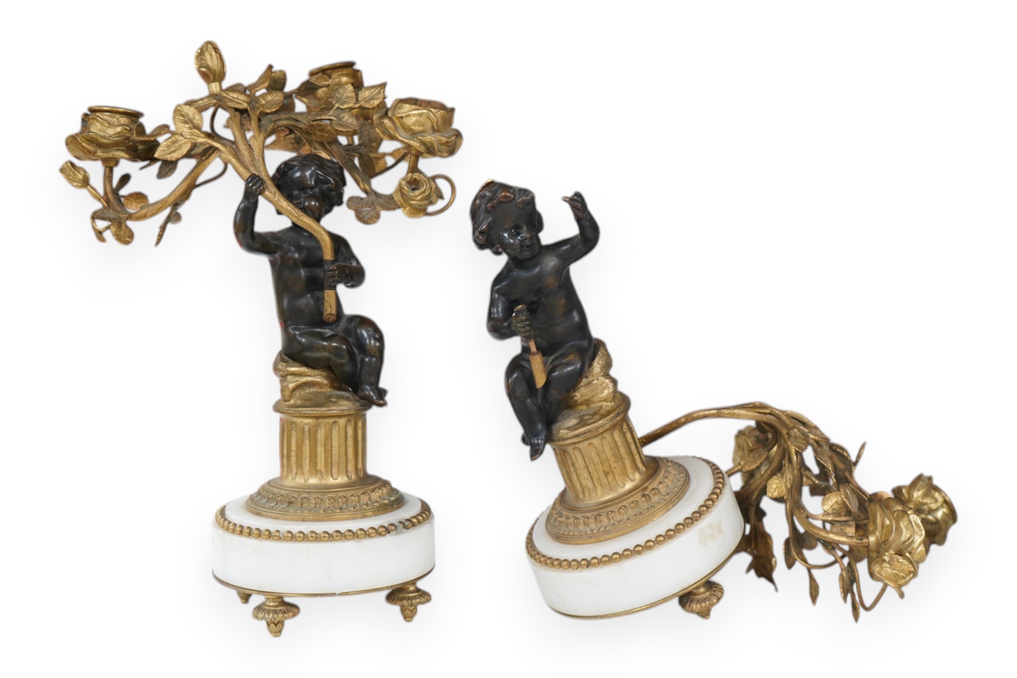 A pair of Louis XVI style bronze, ormolu and white marble figural candelabra, late 19th century, 28cm. Condition - as photographed